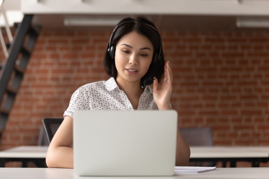 Front View Young Asian Support Service Female Worker Sitting